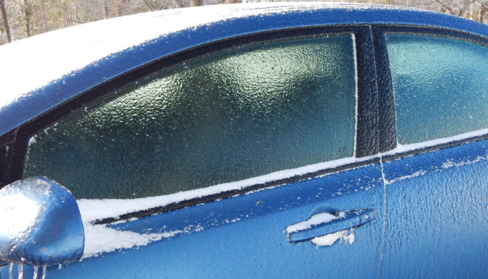 blue car covered in ice